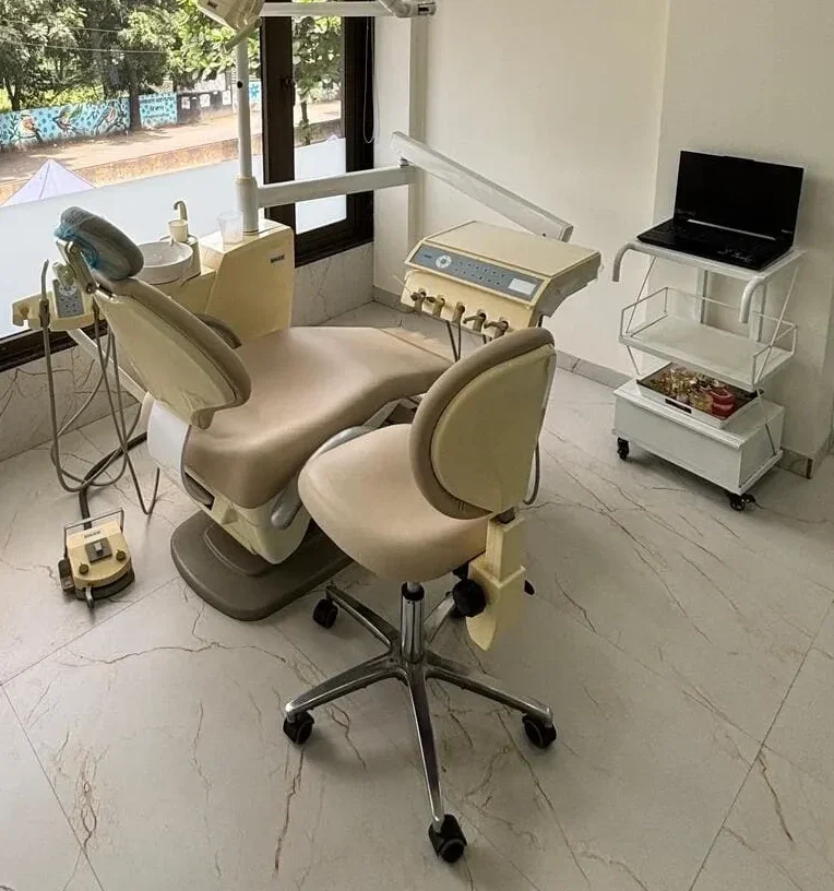 Dentist working with patient model